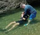 May be an image of swimming and body of water